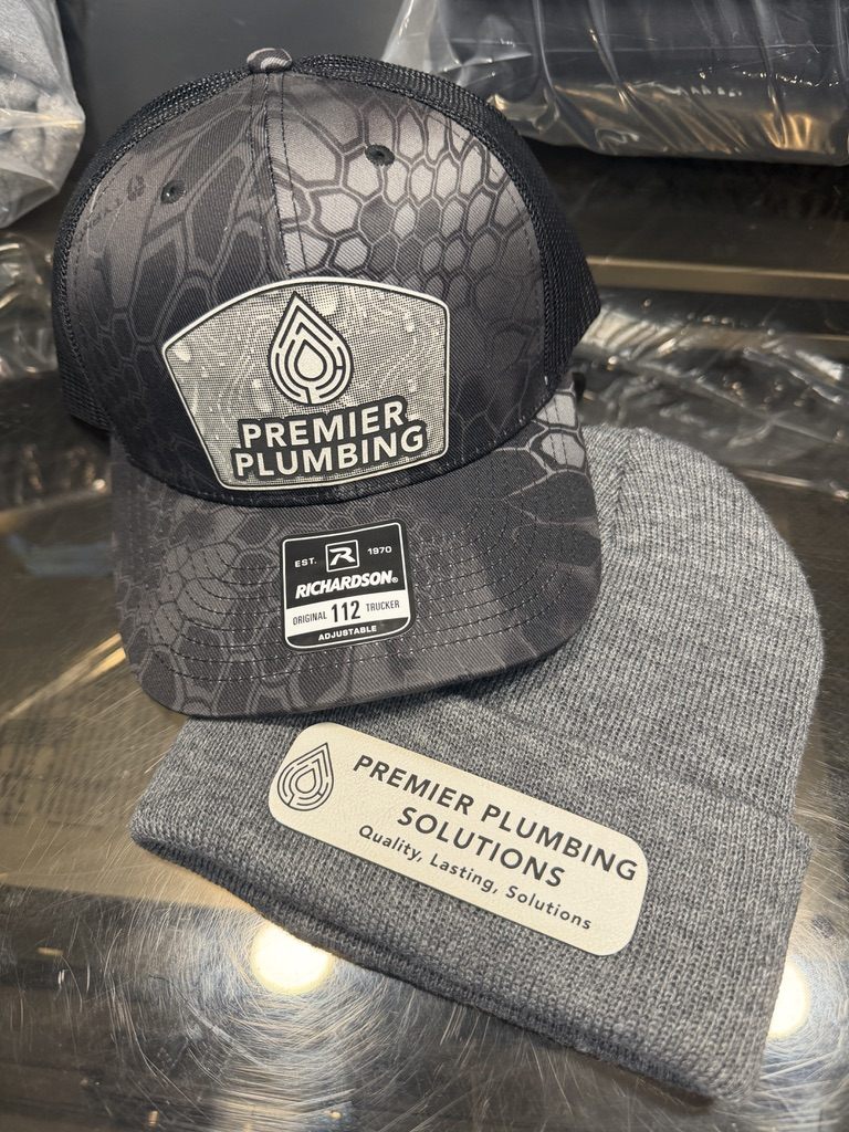 Premier Plumbing branded trucker hat and beanie — business branding by All Phase Laser