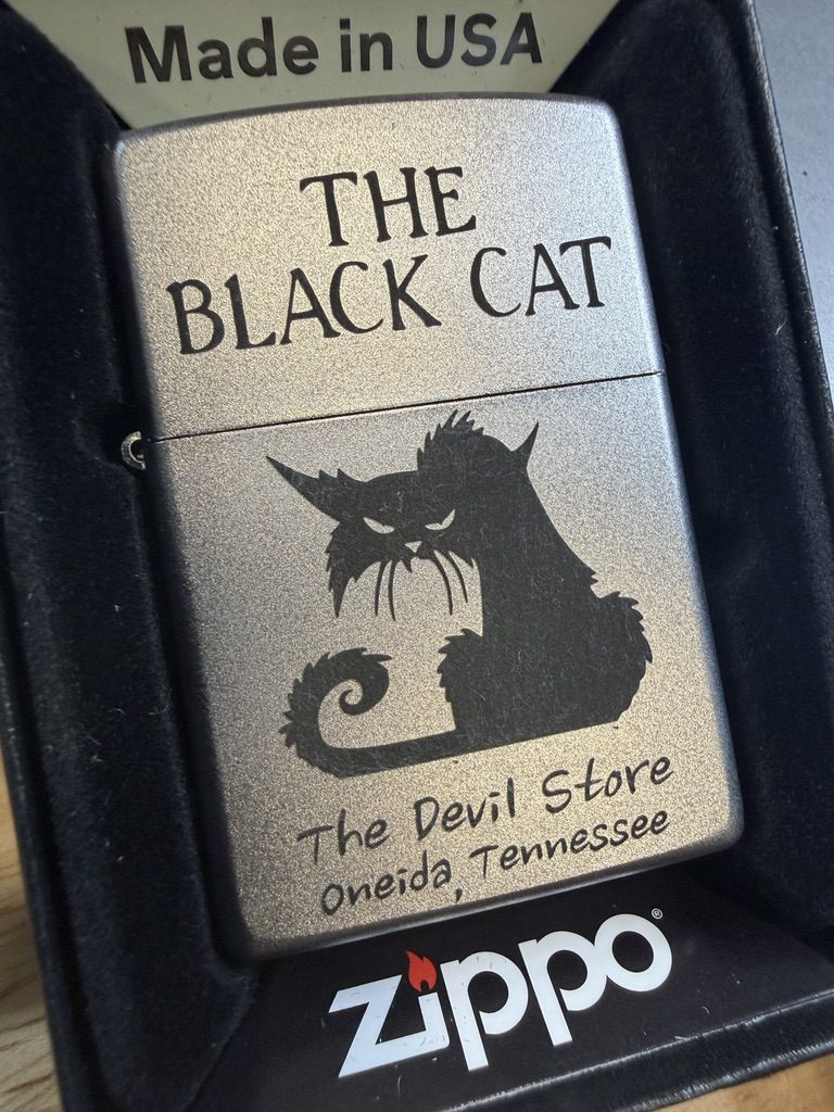 Custom Zippo lighter engraved with The Black Cat design for The Devil Store