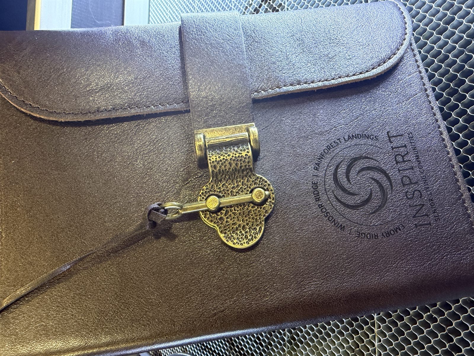 Inspirit branded leather portfolio with engraved logo