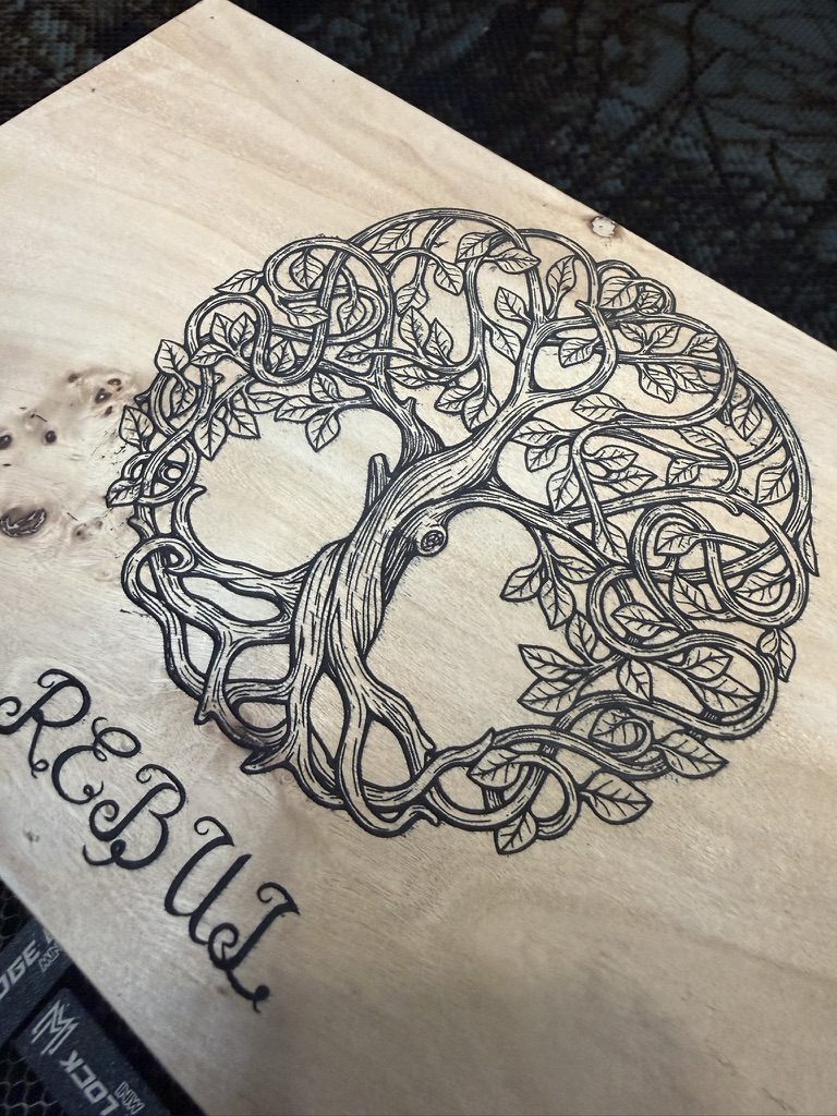 Detailed Celtic Tree of Life engraving on wood