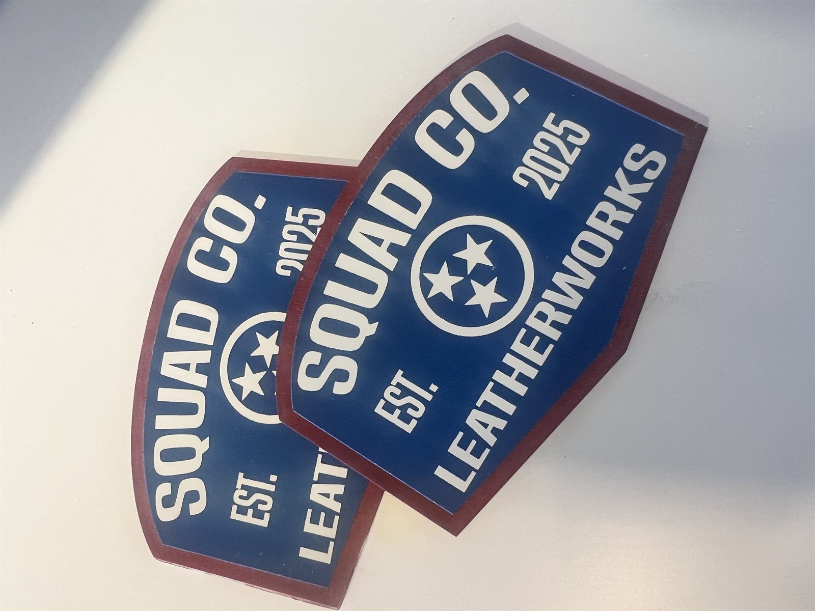 Custom engraved Squad Co. Leatherworks acrylic patches with Tennessee tri-star design