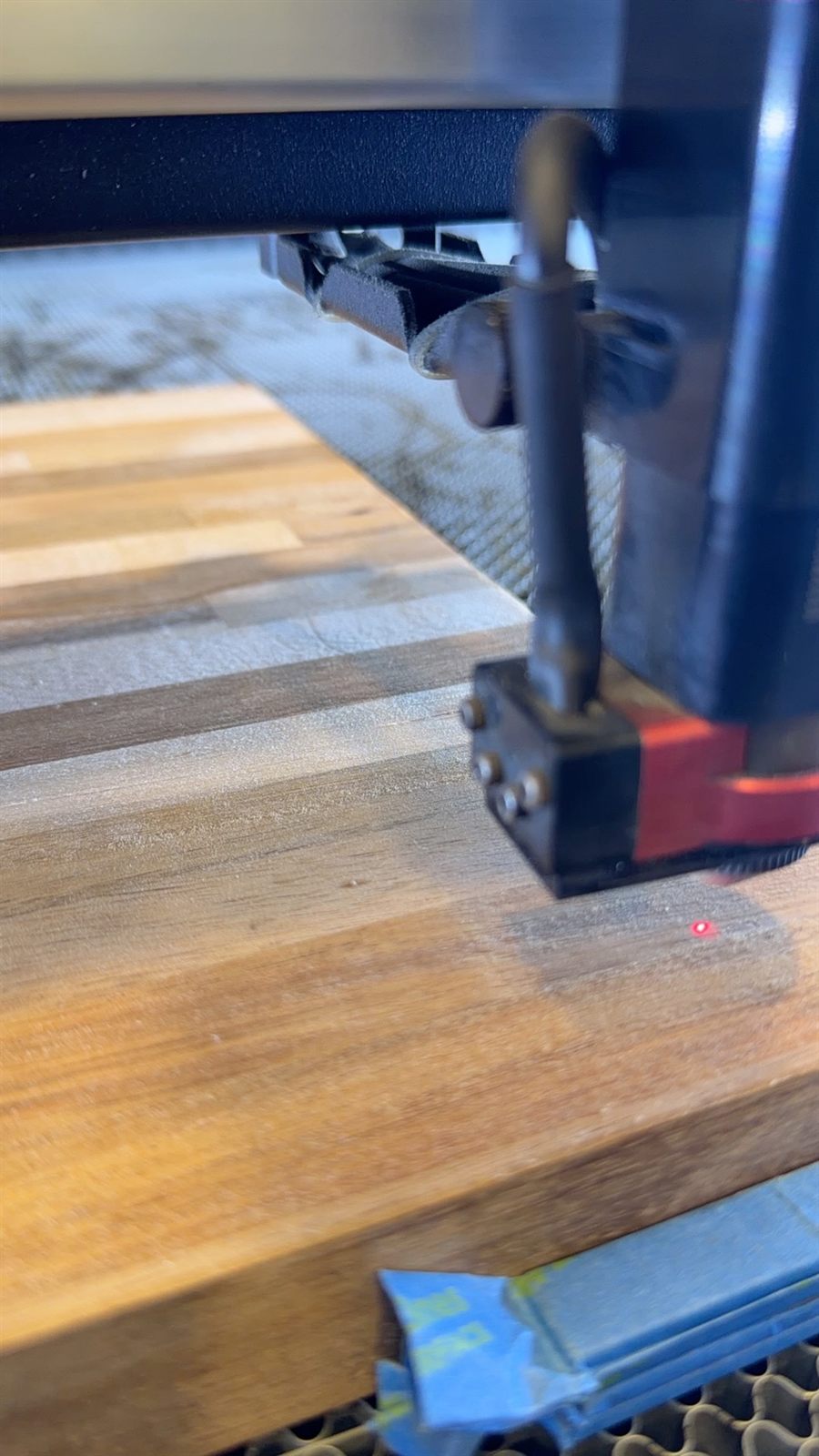 Laser head over butcher block wood